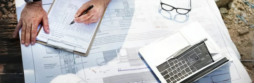 image of IT Site Survey document on a table with blue prints